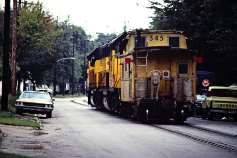 Westbound South Shore Line freight train on 11th Street in Michigan City, Indiana, on September 5, 1981. Photograph by John F. Bjorklund, © 2015, Center for Railroad Photography and Art. Bjorklund-42-11-01