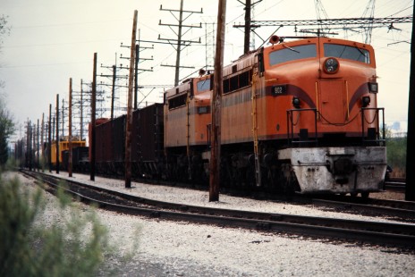 Eastbound South Shore Line freight train at Dune Acres, Indiana, on April 23, 1977.  Photograph by John F. Bjorklund, © 2015, Center for Railroad Photography and Art. Bjorklund-42-07-08
