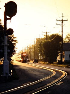 Westbound South Shore Line passenger train on 11th Street in Michigan City, Indiana, on July 9, 2001. Photograph by John F. Bjorklund, © 2015, Center for Railroad Photography and Art. Bjorklund-42-29-10
