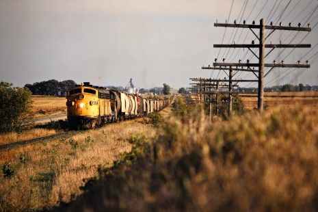 Northbound Chicago and North Western Railway freight train in Albert Lea, Minnesota, on October 5, 1979. Photograph by John F. Bjorklund, © 2015, Center for Railroad Photography and Art. Bjorklund-27-29-03