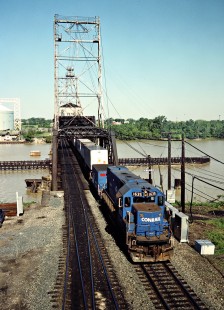 Eastbound Conrail freight train crossing Maumee River in Toledo, Ohio, on June 3, 1984. Photograph by John F. Bjorklund, © 2015, Center for Railroad Photography and Art. Bjorklund-29-09-04
