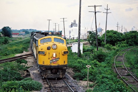 Southbound Chicago and North Western Railway freight train in Reinbeck, Iowa, on May 29, 1977. Photograph by John F. Bjorklund, © 2015, Center for Railroad Photography and Art. Bjorklund-25-18-20.