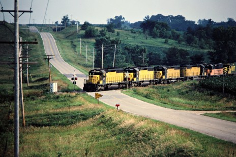 Eastbound Chicago and North Western Railway freight train in Baxter, Iowa, on July 7, 1981. Photograph by John F. Bjorklund, © 2015, Center for Railroad Photography and Art. Bjorklund-27-12-15
