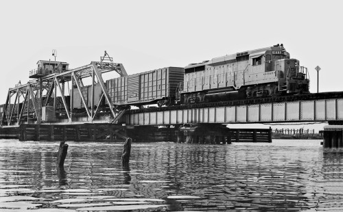 Mobile-bound Louisville and Nashville Railroad local freight train crosses swing bridge at Pascagoula, Mississippi, in August 1963. Photograph by J. Parker Lamb, © 2016, Center for Railroad Photography and Art. Lamb-01-140-07