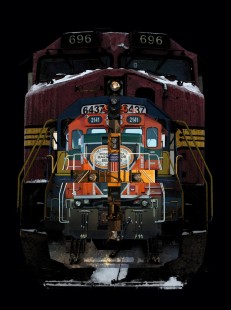 Composite of four locomotives from images taken over a twelve-month period in 2011 and 2012. The subjects are a BNSF Dash-9, a Union Pacific AC4400, an Iowa, Chicago & Eastern SD40-2, and an Indiana Harbor Belt genset. The photographer removed the backgrounds from the original images and replaced them with black, then used various Photoshop filters including watercolor and desaturation in the blending process. "This image explores my interest in comparative juxtaposition and sequential overlay," the photographer said. "In this composite image, the story focuses on the interconnected relationship of transfer railroads."