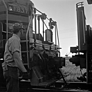Trainman on Alaska Railroad EMD GP7L locomotive no. 1837, c. 1973. Photograph by Leo King, © 2015, Center for Railroad Photography and Art. King-03-014-011