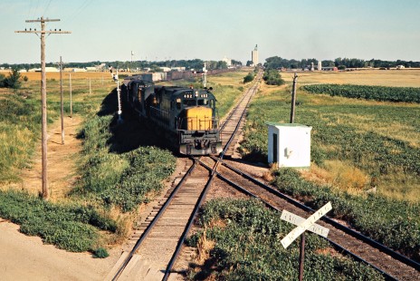 Eastbound Chicago and North Western Railway freight train crossing the Burlington Northern in Arlington, South Dakota, on July 24, 1976. Photograph by John F. Bjorklund, © 2015, Center for Railroad Photography and Art. Bjorklund-25-12-15.