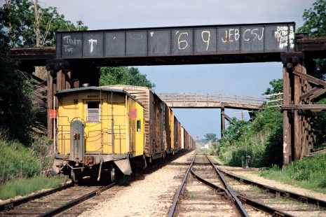 Caboose on an eastbound Chicago and North Western Railway freight train in Melbourne, Iowa, on May 29, 1977. Photograph by John F. Bjorklund, © 2015, Center for Railroad Photography and Art. Bjorklund-25-18-07.