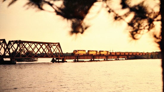 Eastbound Chicago and North Western Railway freight train crossing bridge over the Wisconsin River near Dellwood, Wisconsin, on July 4, 1975. Photograph by John F. Bjorklund, © 2015, Center for Railroad Photography and Art. Bjorklund-24-14-19.