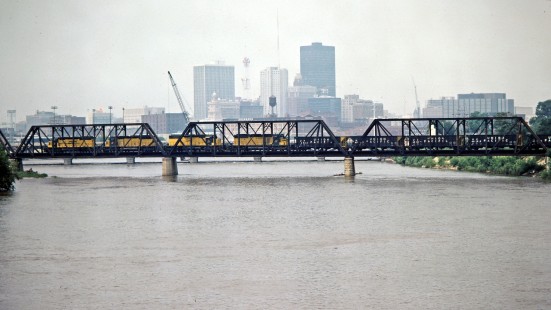 Westbound Chicago and North Western Railway freight train crossing bridge over the Des Moines River in Des Moines, Iowa, on July 7, 1981. Photograph by John F. Bjorklund, © 2015, Center for Railroad Photography and Art. Bjorklund-28-15-03