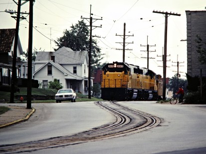 Eastbound South Shore Line GP38-2 locomotives and caboose on 11th Street in Michigan City, Indiana, on September 5, 1981. Photograph by John F. Bjorklund, © 2015, Center for Railroad Photography and Art. Bjorklund-42-12-12