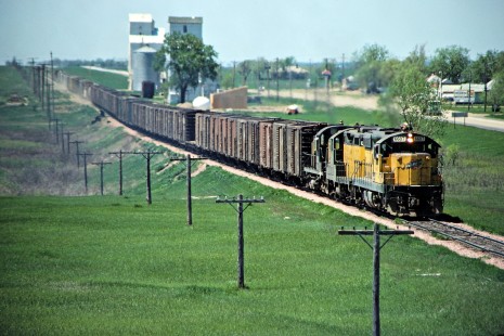 Eastbound Chicago and North Western Railway freight train in Iroquois, South Dakota, on May 20, 1978. Photograph by John F. Bjorklund, © 2015, Center for Railroad Photography and Art.  Bjorklund-28-08-07