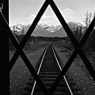 View of track through the rear gate of an Alaska Railroad passenger train, c. 1973. Photograph by Leo King, © 2015, Center for Railroad Photography and Art. King-03-020-002
