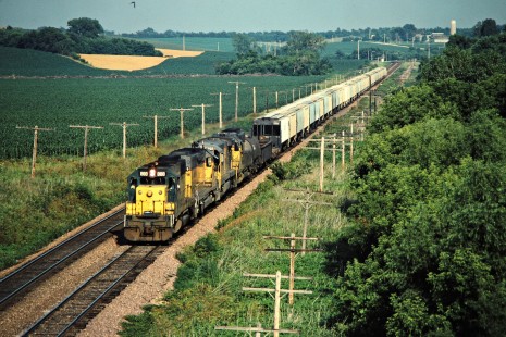 Westbound Chicago and North Western Railway freight train in Marshalltown, Iowa, on July 5, 1981. Photograph by John F. Bjorklund, © 2015, Center for Railroad Photography and Art. Bjorklund-28-12-19