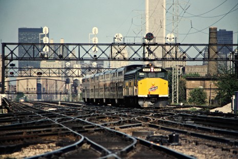 Westbound Chicago and North Western Railway commuter passenger train in Chicago, Illinois, in May 1981. Photograph by John F. Bjorklund, © 2015, Center for Railroad Photography and Art. Bjorklund-27-18-16