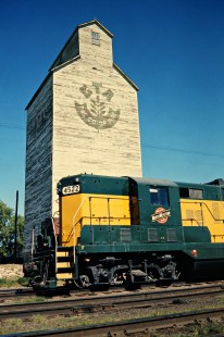 Southbound Chicago and North Western Railway and grain elevator in Randolph, Minnesota, on July 17, 1976. Photograph by John F. Bjorklund, © 2015, Center for Railroad Photography and Art. Bjorklund-24-24-16.