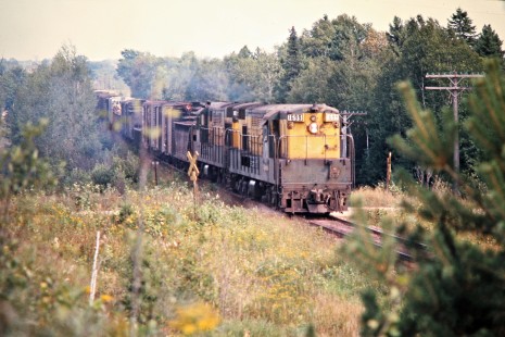 Westbound/Southbound Chicago and North Western Railway ore train in Bark River, Michigan, on September 2, 1973. Photograph by John F. Bjorklund, © 2015, Center for Railroad Photography and Art. Bjorklund-24-08-10.