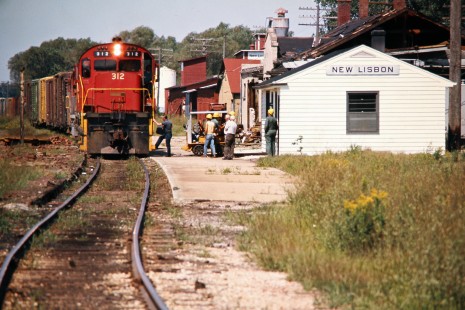 Eastbound Green Bay and Western Railroad freight train stopping at station in New Lisbon, Wisconsin, on August 26, 1975. Photograph by John F. Bjorklund, © 2015, Center for Railroad Photography and Art. Bjorklund-43-01-02