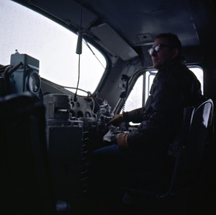 Engineer in the cab of an Alaska Railroad F-unit locomotive, c. 1968. Photograph by Leo King, © 2015, Center for Railroad Photography and Art. King-02-032-006