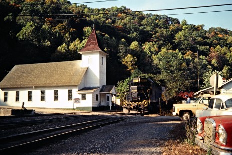 Southbound Clinchfield Railroad freight train passing the Union Baptist Church in Dante, Virginia, on October 15, 1980. Photograph by John F. Bjorklund, © 2015, Center for Railroad Photography and Art. Bjorklund-41-19-04