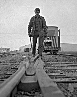 Alaska Railroad crewman inspecting track, c. 1973. Photograph by Leo King, © 2015, Center for Railroad Photography and Art. King-03-068-005