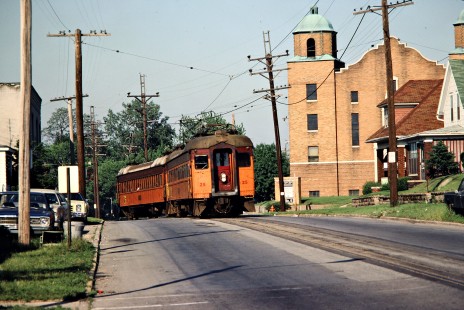 Westbound South Shore Line passenger train on 11th Street in Michigan City, Indiana, on June 14, 1980. Photograph by John F. Bjorklund, © 2015, Center for Railroad Photography and Art. Bjorklund-42-08-01