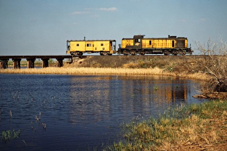 Southbound Chicago and North Western Railway Alco RSD5 locomotive no. 1684 and caboose in Mansfield, South Dakota, on May 17, 1978. Photograph by John F. Bjorklund, © 2015, Center for Railroad Photography and Art. Bjorklund-26-03-03