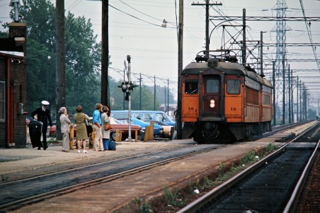 Westbound South Shore Line passenger train at station in Hegewisch, Illinois, on May 31, 1976. Photograph by John F. Bjorklund, © 2015, Center for Railroad Photography and Art. Bjorklund-42-04-11