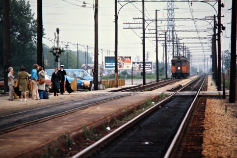 Westbound South Shore Line passenger train approaching station in Hegewisch, Illinois, on May 31, 1976. Photograph by John F. Bjorklund, © 2015, Center for Railroad Photography and Art. Bjorklund-42-04-12