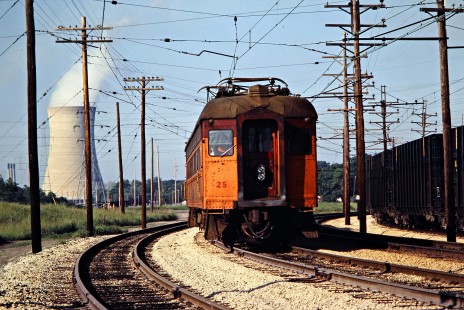 Westbound South Shore Line passenger train at Michigan City, Indiana, on June 14, 1980. The cooling tower of the Michigan City Generating Station is in the background. Photograph by John F. Bjorklund, © 2015, Center for Railroad Photography and Art. Bjorklund-42-09-14