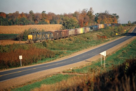 Eastbound Chicago and North Western Railway freight train in Janesville, Minnesota, on October 2, 1977. Photograph by John F. Bjorklund © 2015, Center for Railroad Photography and Art. Bjorklund-25-27-18