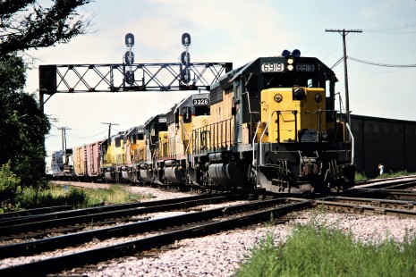 Eastbound Chicago and North Western Railway freight train in Rochelle, Illinois, on August 11, 1991. Photograph by John F. Bjorklund, © 2015, Center for Railroad Photography and Art. Bjorklund-28-13-02