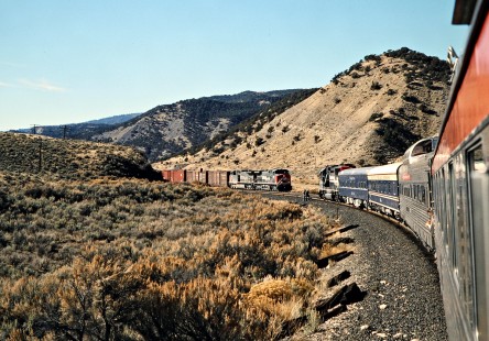 Private passenger train meeting a freight train on Southern Pacific's former Denver and Rio Grande Western main line in Dotsero, Colorado, on November 19, 1995. Photograph by John F. Bjorklund, © 2015, Center for Railroad Photography and Art. Bjorklund-49-20-12