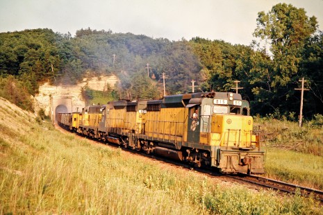 Westbound Chicago and North Western Railway freight train passing through tunnel in Tunnel City, Wisconsin, on July 5, 1975. Photograph by John F. Bjorklund, © 2015, Center for Railroad Photography and Art. Bjorklund-24-15-12.
