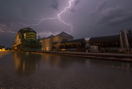 A fierce storm with flooding rain and frequent lightning bolts illuminates the Minnesota Southern's GP9 in Luverne, MN.
