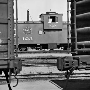 Portrait of new Missouri–Kansas–Texas Railroad steel caboose, waiting for assignment in yard at Waco, Texas, in May 1967. Photograph by J. Parker Lamb, © 2016, Center for Railroad Photography and Art. Lamb-02-041-12