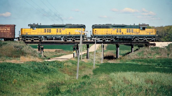 Eastbound Chicago and North Western Railway freight train with two EMD SD9 locomotives in Owatonna, Minnesota, on October 2, 1977. Photograph by John F. Bjorklund, © 2015, Center for Railroad Photography and Art. Bjorklund-26-01-18