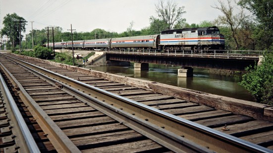 Northbound Amtrak passenger train on Conrail track near Rockwood, Michigan, on May 5, 1985. Photograph by John F. Bjorklund, © 2015, Center for Railroad Photography and Art. Bjorklund-29-13-15