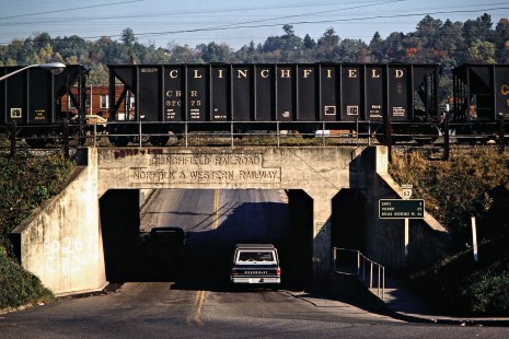Southbound Clinchfield Railroad hopper cars crossing bridge in St. Paul, Virginia, on October 15, 1980. Photograph by John F. Bjorklund, © 2015, Center for Railroad Photography and Art. Bjorklund-41-18-15