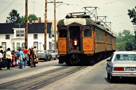 Crowd waits for westbound South Shore Line passenger train in Michigan City, Indiana, on May 16, 1982. Photograph by John F. Bjorklund, © 2015, Center for Railroad Photography and Art. Bjorklund-42-16-19