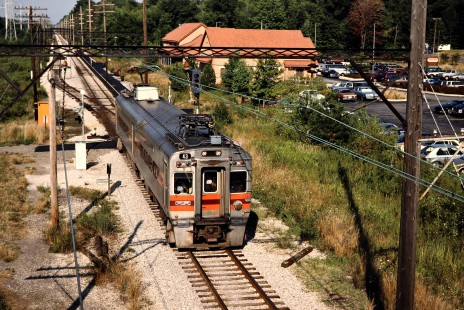 Westbound South Shore Line passenger train at station in Dune Park, Indiana, on August 12, 1991. Photograph by John F. Bjorklund, © 2015, Center for Railroad Photography and Art. Bjorklund-42-22-12