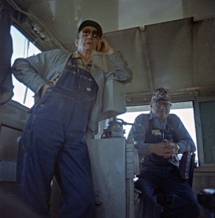 Two Alaska Railroad crewmen (right, engineer Kenny Fuller) in locomotive cab, c. 1968. Photograph by Leo King, © 2015, Center for Railroad Photography and Art. King-02-043-002