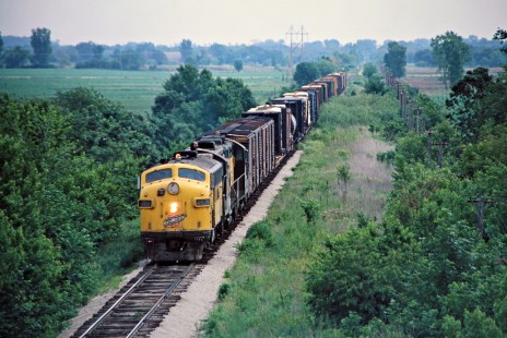 Southbound Chicago and North Western Railway freight train in Dunkerton, Iowa, on May 29, 1977. Photograph by John F. Bjorklund, © 2015, Center for Railroad Photography and Art. Bjorklund-25-17-22.