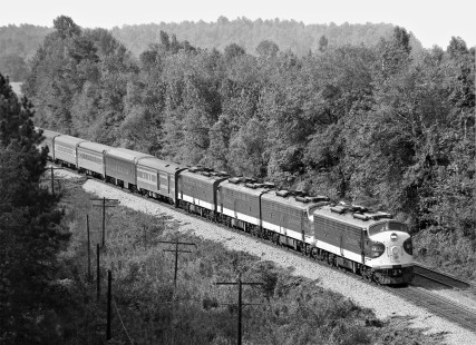 Southbound Southern Railway <i>Southern Crescent</i> passenger train passes through break in heavily-timbered terrain south of Meridian, Mississippi, in August 1974. Photograph by J. Parker Lamb, © 2016, Center for Railroad Photography and Art. Lamb-01-112-07