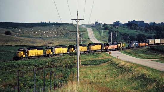 Eastbound Chicago and North Western Railway freight train in Baxter, Iowa, on July 7, 1981. Photograph by John F. Bjorklund, © 2015, Center for Railroad Photography and Art. Bjorklund-28-16-17