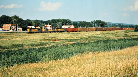 Westbound Chicago and North Western Railway freight train in Cambria, Minnesota, on July 21, 1976. Photograph by John F. Bjorklund, © 2015, Center for Railroad Photography and Art. Bjorklund-25-01-03.