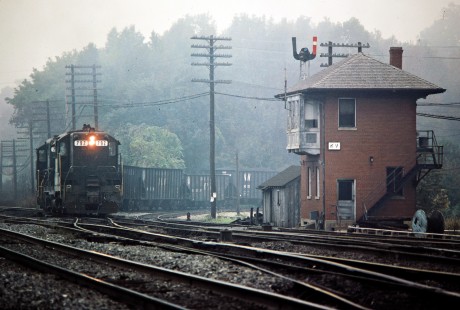 Norfolk & Western GP9 no. 792 leads an N&W coal train onto the Chesapeake and Ohio Railway at KV Cabin in Kenova, West Virginia, on October 1, 1982. Photograph by John F. Bjorklund, © 2015, Center for Railroad Photography and Art. Bjorklund-35-14-01