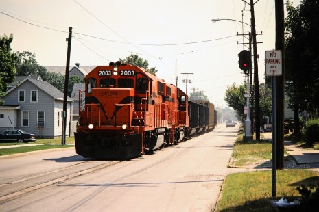 Westbound South Shore Line freight train on 11th Street in Michigan City, Indiana, on July 9, 2001. Photograph by John F. Bjorklund, © 2015, Center for Railroad Photography and Art. Bjorklund-42-30-06