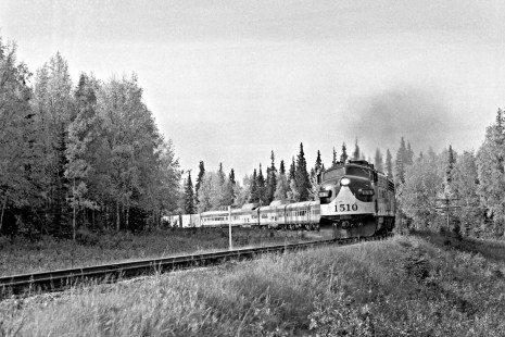 Alaska Railroad EMD FP7A locomotive no. 1510 leads a passenger train through a curve, c. 1973. Photograph by Leo King, © 2015, Center for Railroad Photography and Art. King-03-056-001