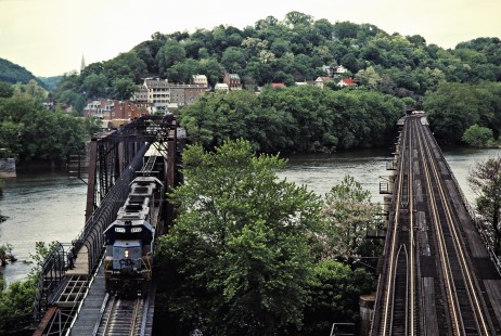 Eastbound CSX Transportation freight train crossing the Potomac River in Harpers Ferry, West Virginia, on May 20, 1993. Photograph by John F. Bjorklund, © 2015, Center for Railroad Photography and Art. Bjorklund-44-29-09